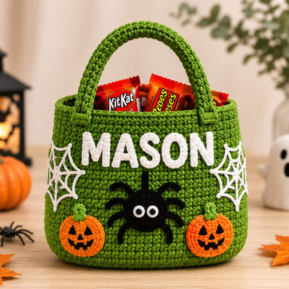 Green crochet candy tote with a black spider, cobwebs, jack-o-lanterns and a stitched name